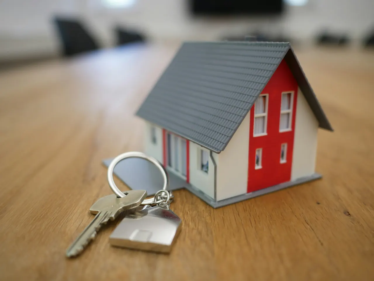 Residential home and keys representing rental housing